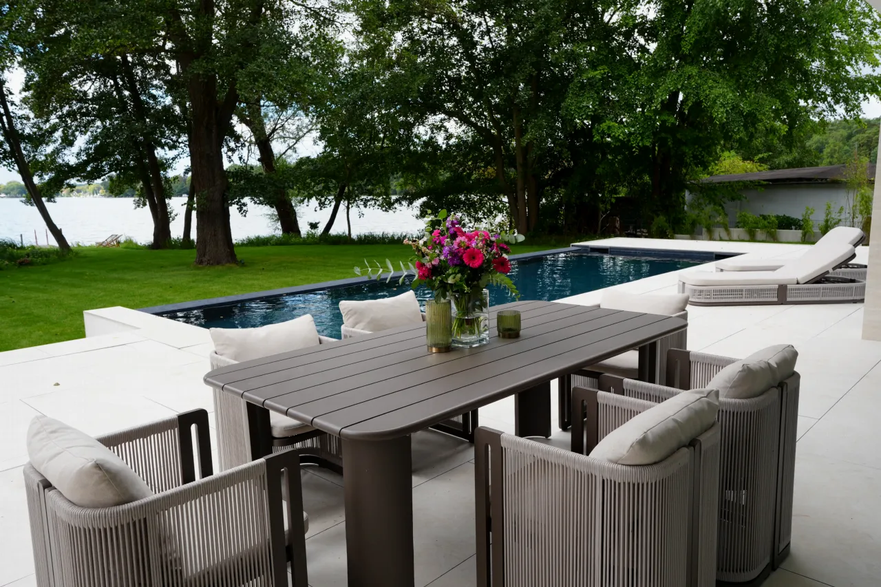 Terrace with dining area, pool and a view of the lake